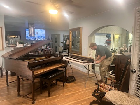 Repair work on a grand piano
